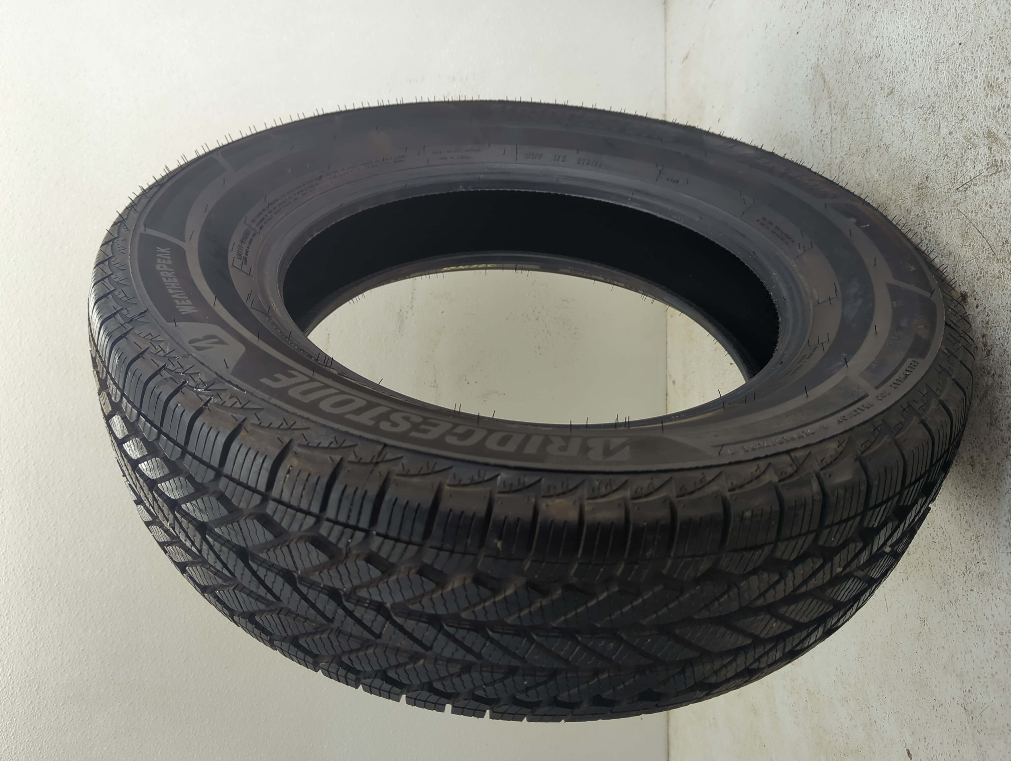 Used Tire 225/65R17 BRIDGESTONE WEATHERPEAK 102H - Tread Depth 10/32 - Oemusedautoparts1.com