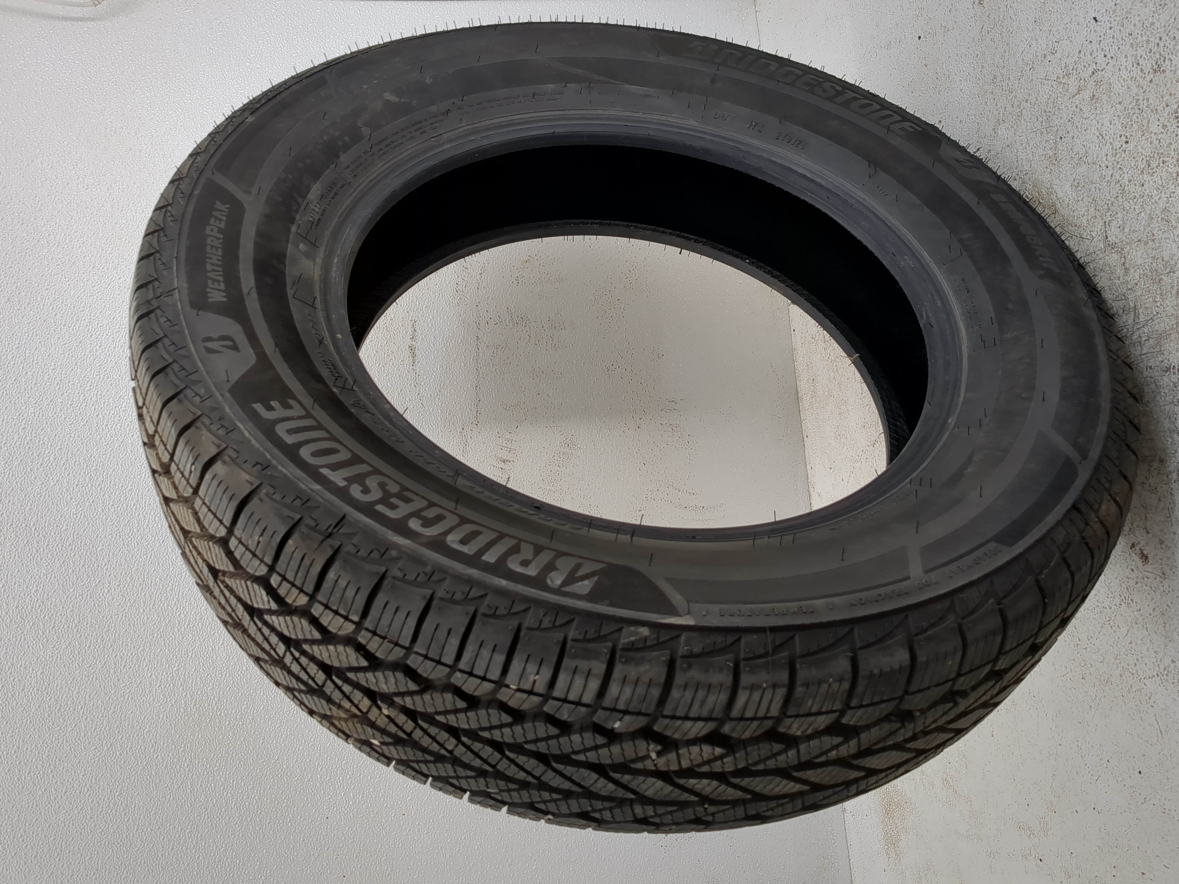 Used Tire 225/65R17 BRIDGESTONE WEATHERPEAK 102H - Tread Depth 10/32 - Oemusedautoparts1.com