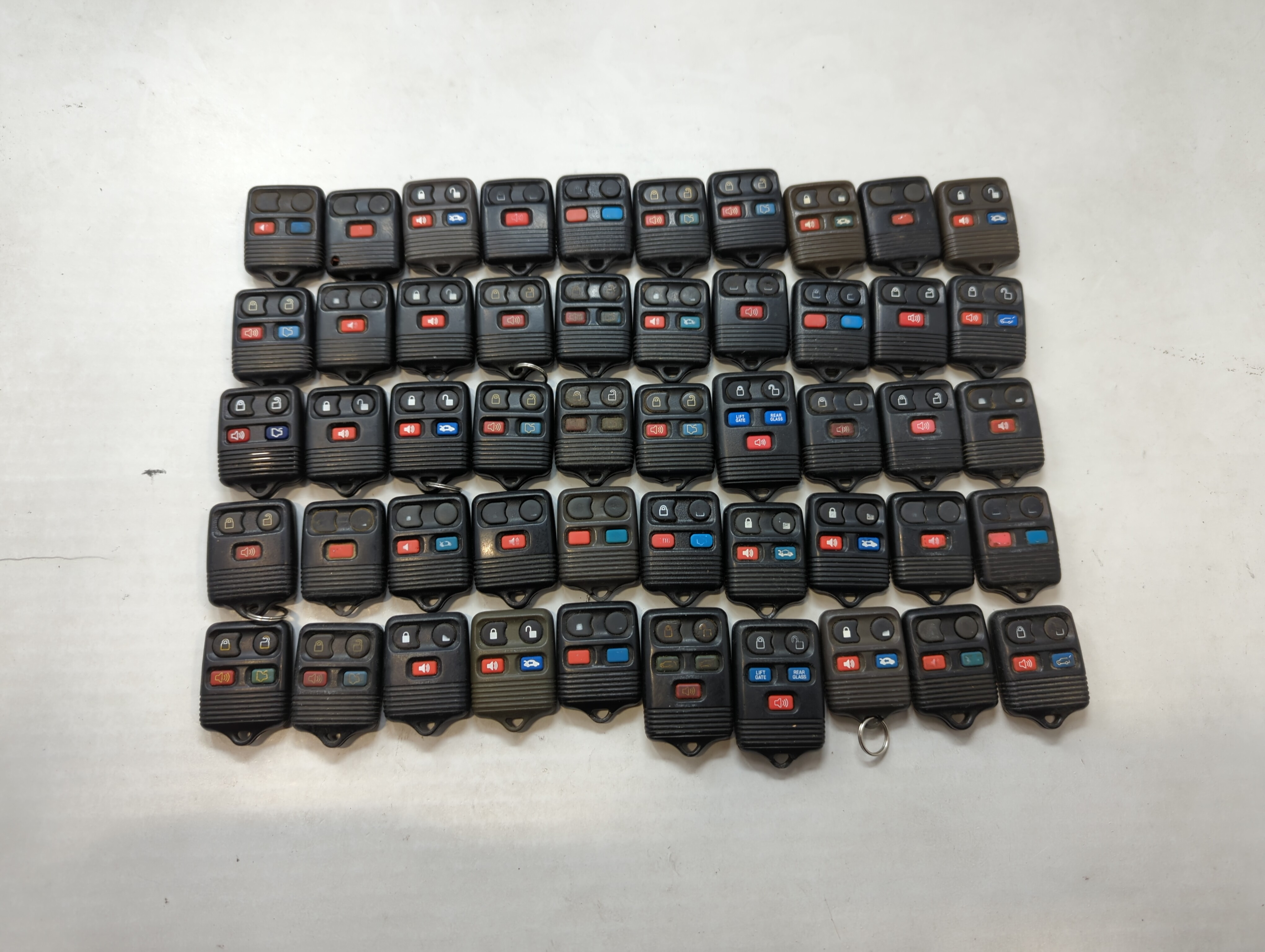 Picture of Lot of 50 Ford Keyless Entry Remote Fob MIXED FCC IDS MIXED PART NUMBERS 557853