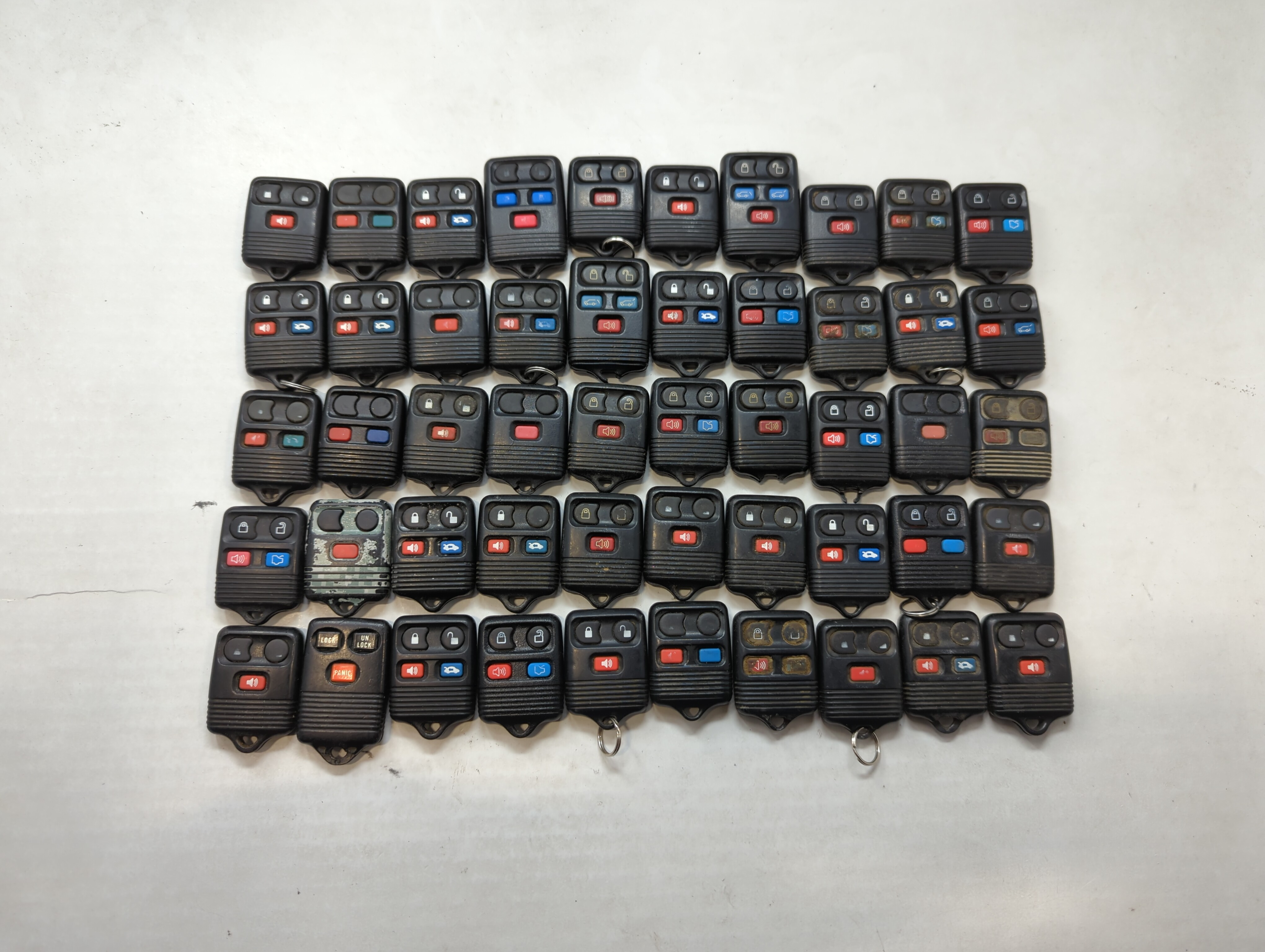 Picture of Lot of 50 Ford Keyless Entry Remote Fob MIXED FCC IDS MIXED PART NUMBERS 557854