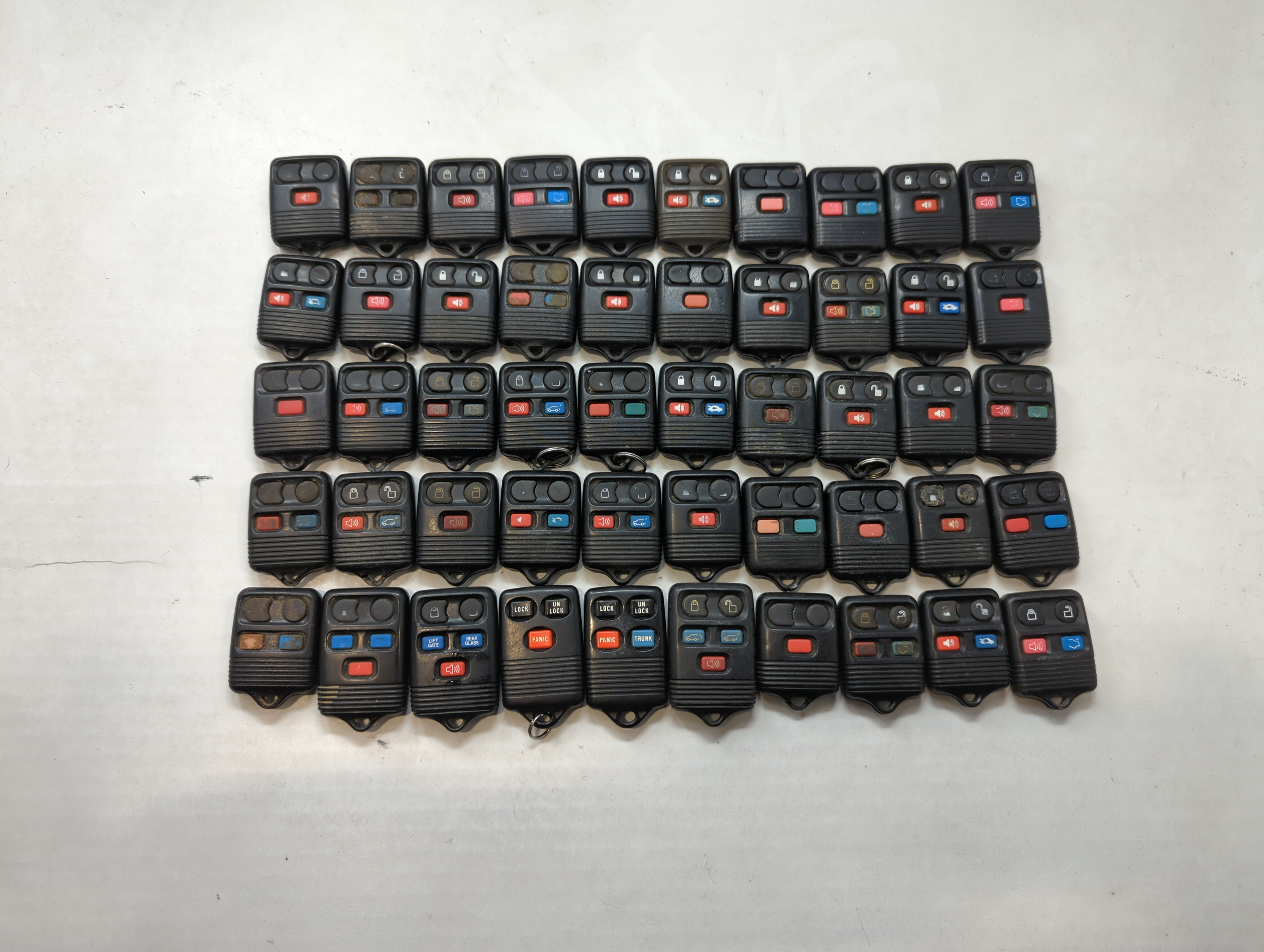 Picture of Lot of 50 Ford Keyless Entry Remote Fob MIXED FCC IDS MIXED PART NUMBERS 557856