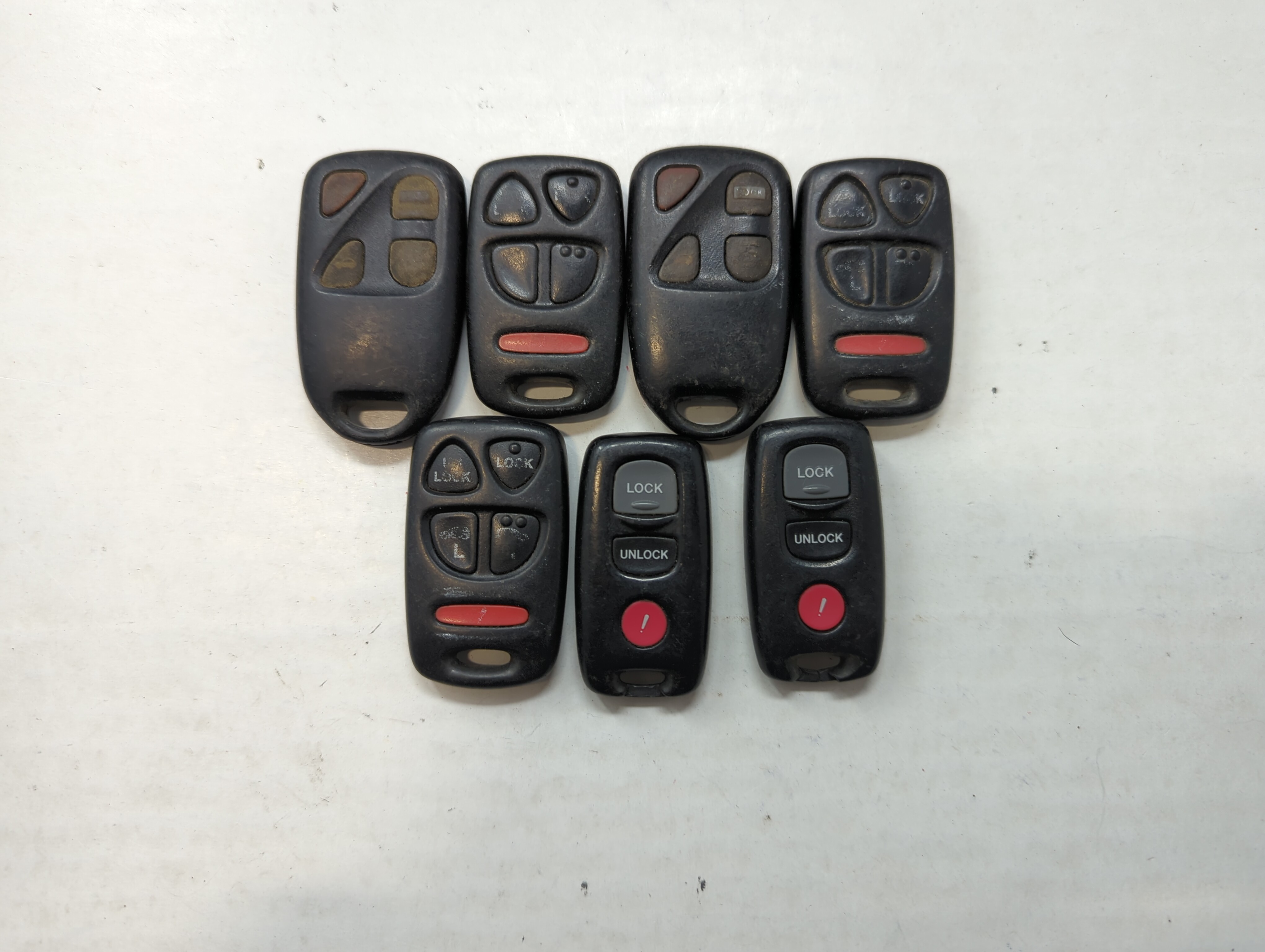 Lot of 7 Mazda Keyless Entry Remote Fob MIXED FCC IDS MIXED PART NUMBERS 558955 - Oemusedautoparts1.com