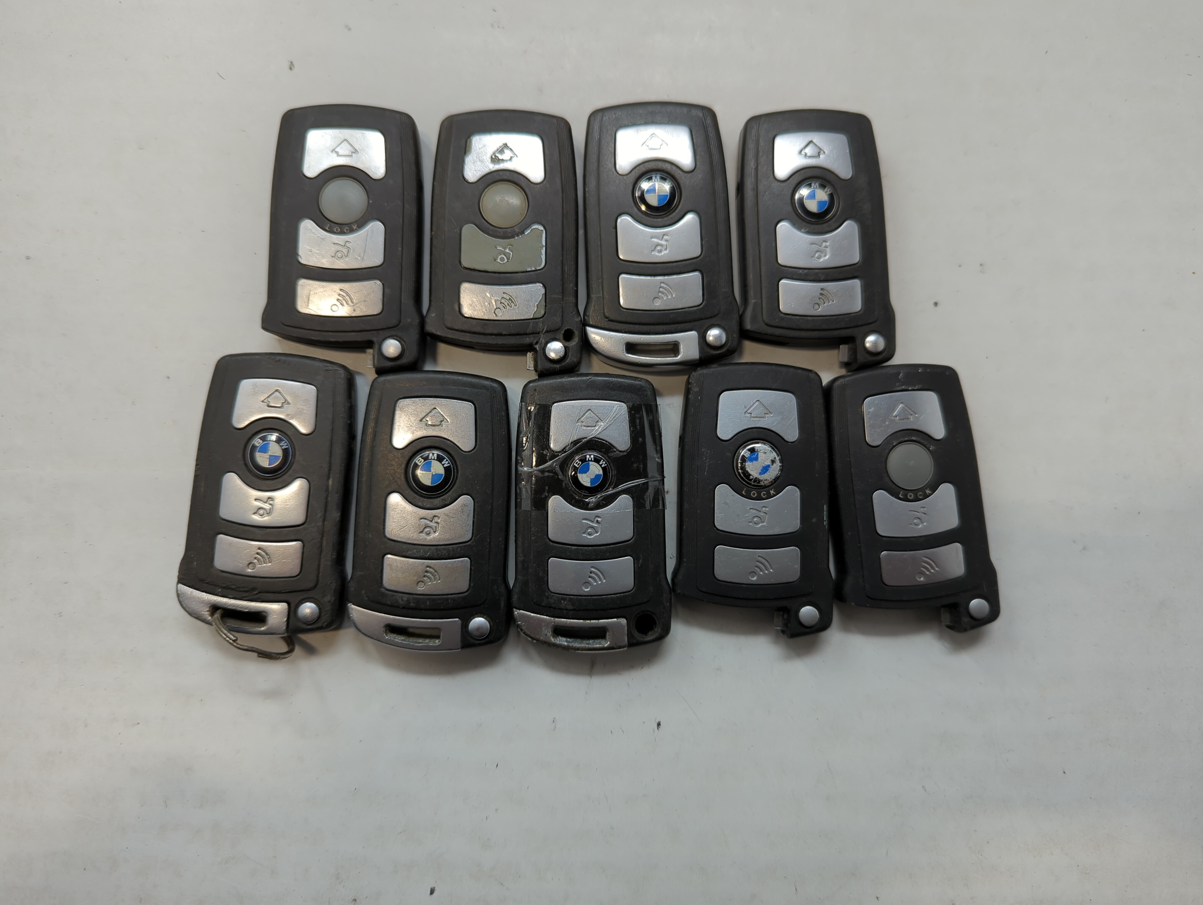 Picture of Lot of 9 Bmw Keyless Entry Remote Fob MIXED FCC IDS MIXED PART NUMBERS 559446