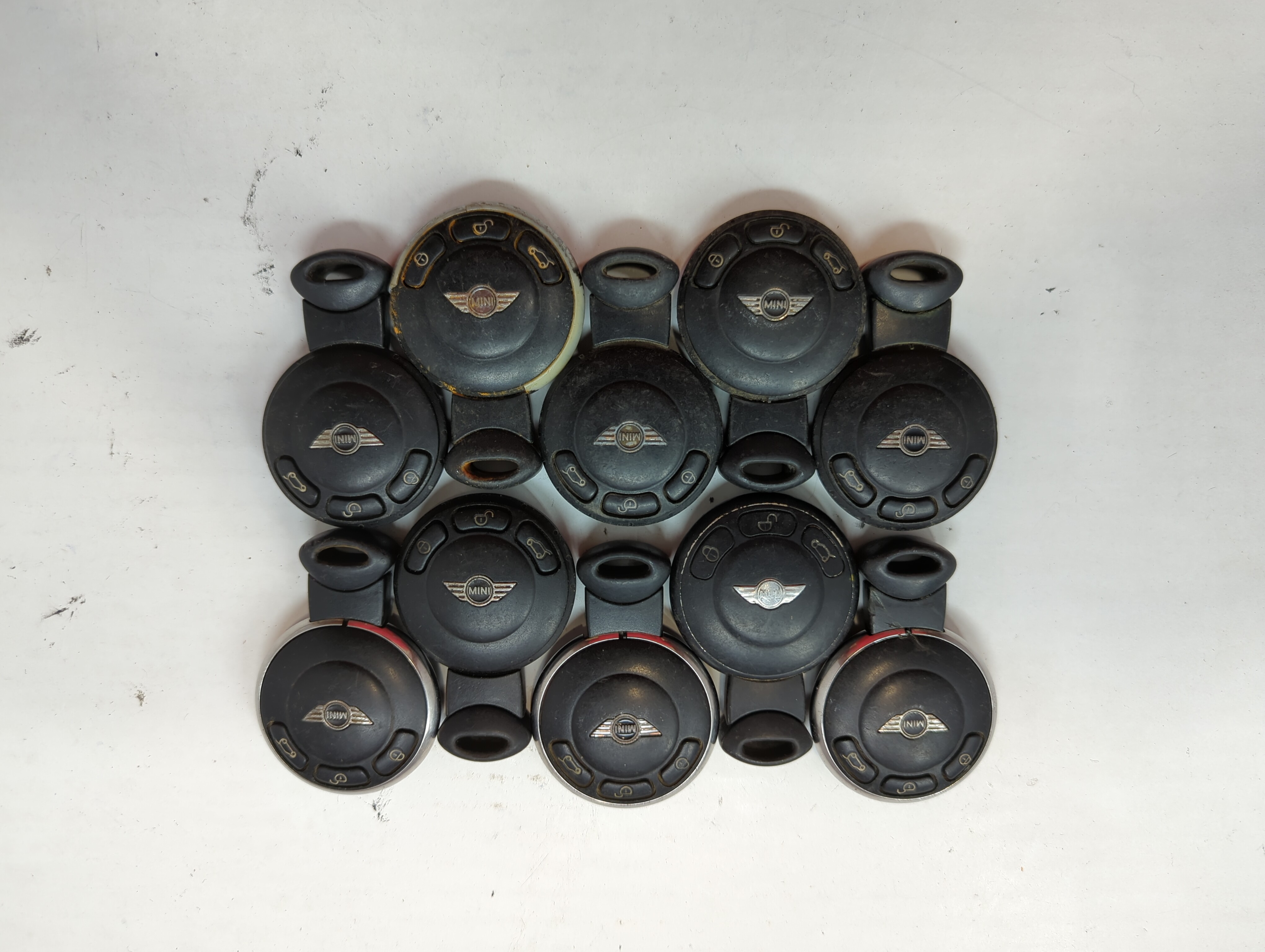 Picture of Lot of 10 Mini Keyless Entry Remote Fob MIXED FCC IDS MIXED PART NUMBERS 641212